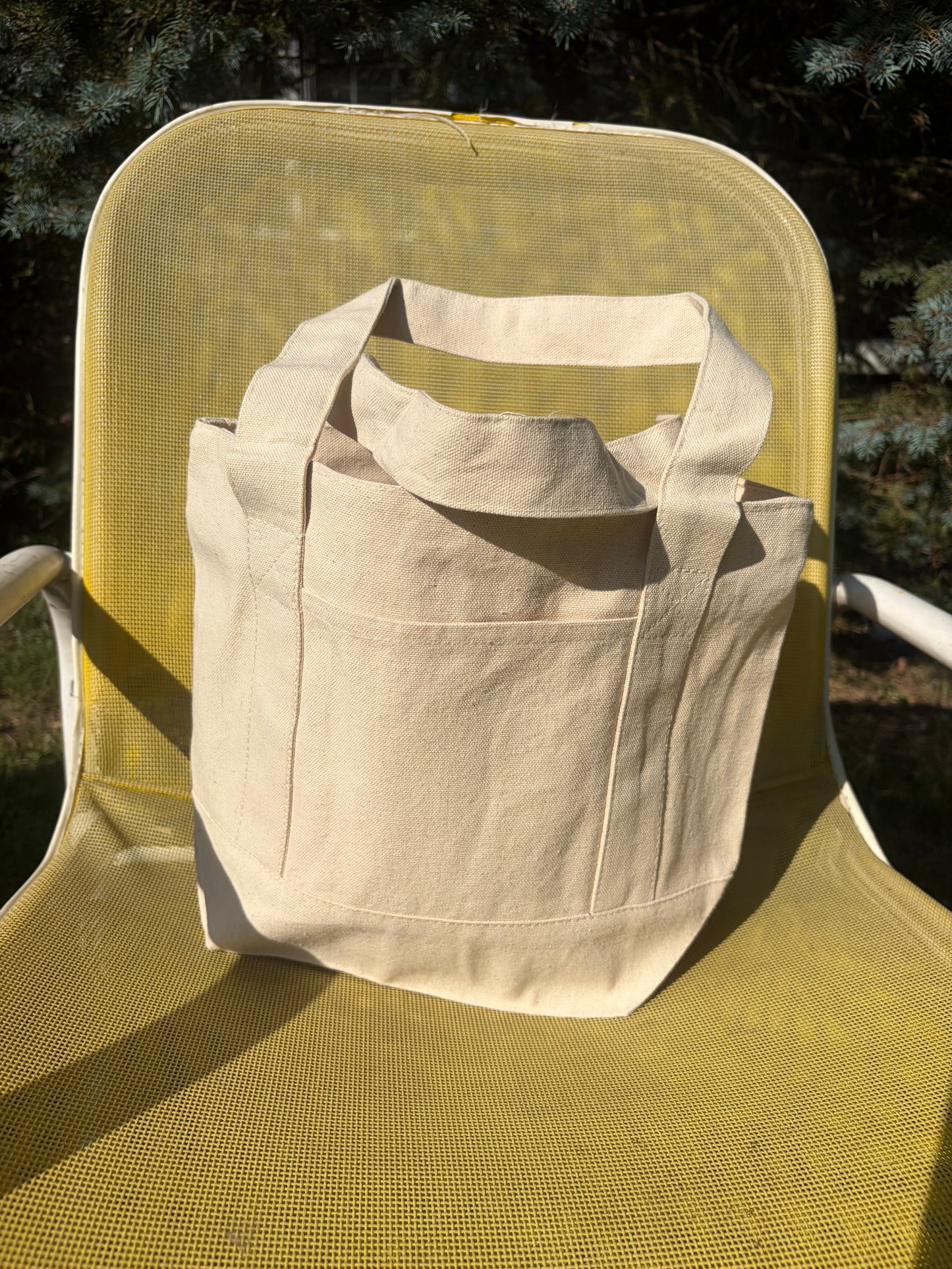Small canvas tote with front pocket and zipper