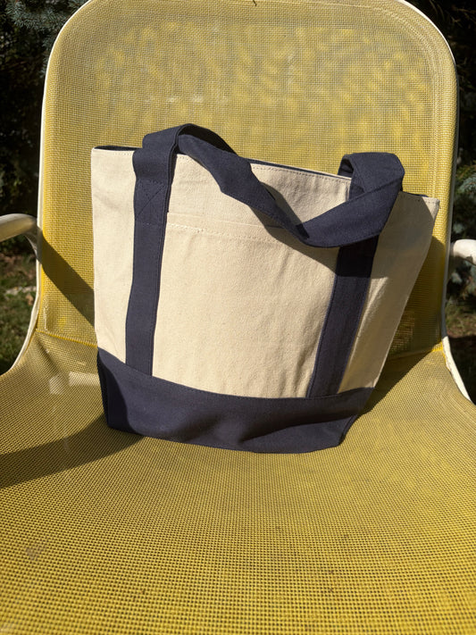 Small canvas tote with front pocket and zipper